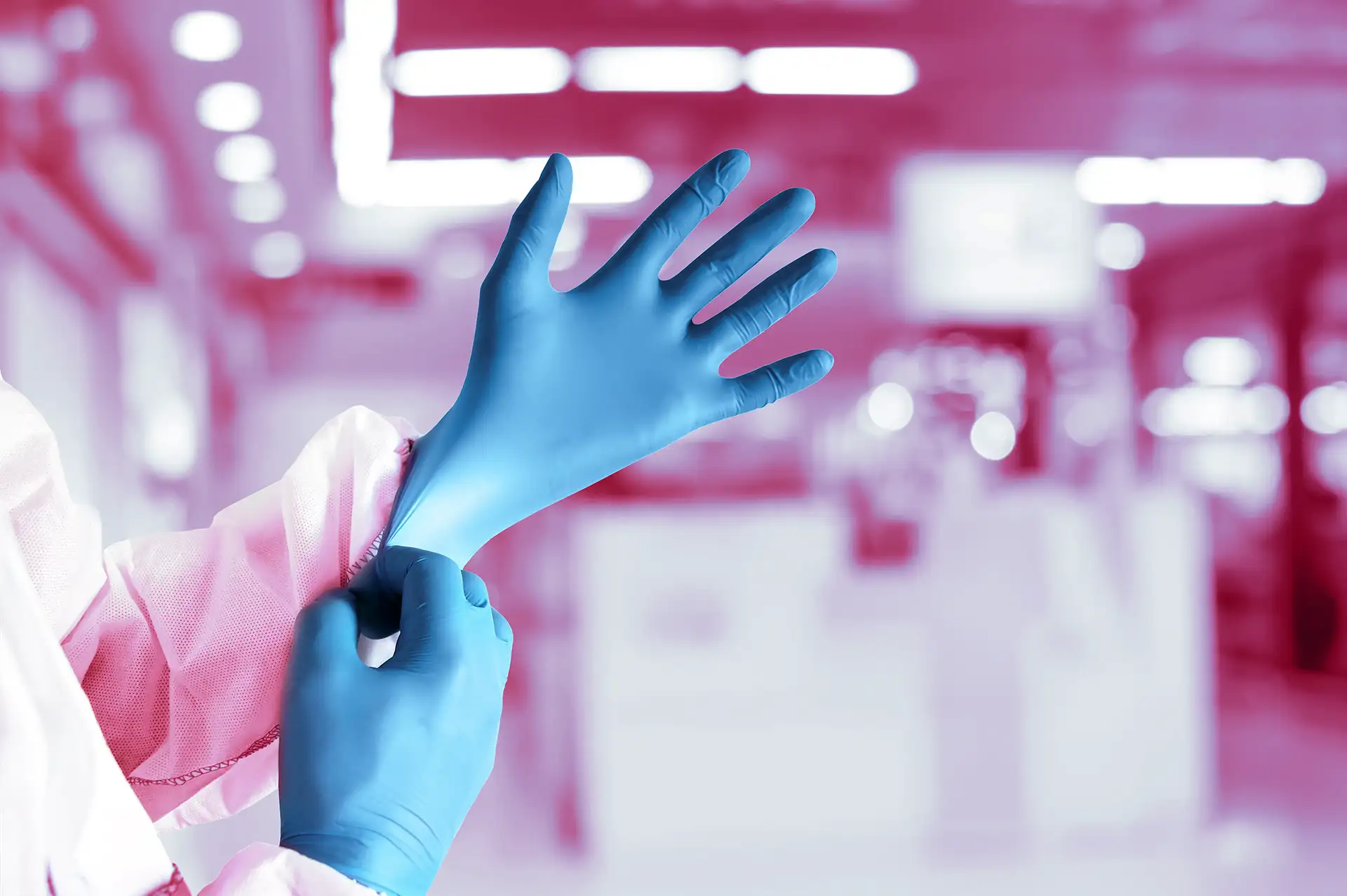 Person puts on protective gloves in clean room | Protect2Clean